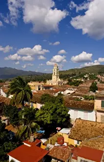 View from above with great clouds of the old Colonial village of Trinidad Cuba buildings