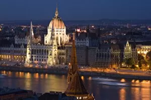 Images Dated 30th June 2007: View of Parliament Buildings along Danube River at dusk, Budapest, Capital of Hungary