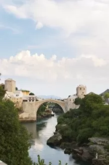 View along the river of the old reconstructed bridge. Historic town of Mostar. Federation