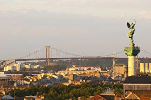A view over the rooftops and city of Bordeaux with the Pont d Aquitaine over