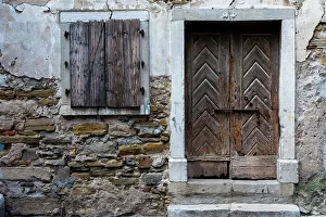 Closed Prints: A view of a wooden door and shuttered window. Isola, Slovenia