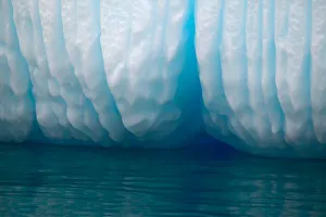 Channel Prints: Viewing icebergs in blue in the Errera Channel via Zodiak boats. Antarctica peninsula