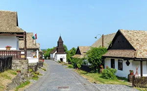 Settlement Prints: Village high street with church