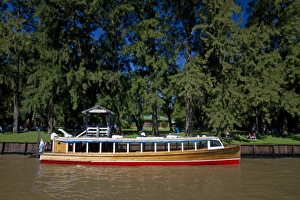 Vintage mahogany motorboat on the Parana Delta at Tigre, Argentina
