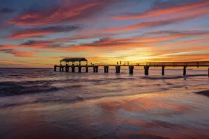 Inspiring Prints: Vivid sunrise clouds silhouette Waimea Pier with Ni ihau Island in distance in Kauai