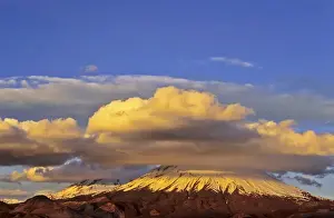 Vulcano Parinacota (6342m) and Pomerape (6286m) Chile during sunset are part of