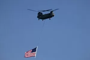 WA, Seattle, Boeing Chinook Helicopter with American Flag, at SEAFAIR