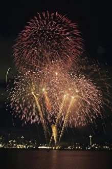 WA, Seattle, Fireworks on July 4th, at Gasworks Park; Space Needle in background