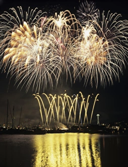 WA, Seattle, Fireworks on July 4th, at Gasworks Park; Space Needle in background