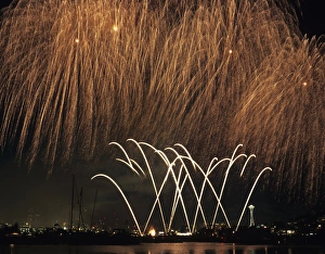 WA, Seattle, Fireworks on July 4th, at Gasworks Park; Space Needle in background