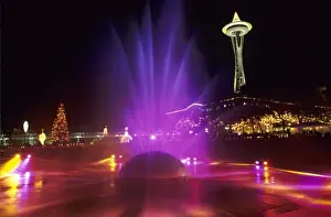 Space Needle Prints: WA, Seattle, International Fountain with holiday lights and the Space Needle Seattle
