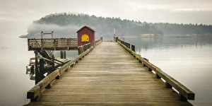 Washington, San Juan Islands, Stuart Island, Prevost Harbor. Dock on a cloudy day
