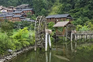 Ethnic Minority Prints: Waterwheel on the river in the Dong village, Zhaoxing, Guizhou Province, China