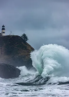 Powerful Prints: Waves crash below lighthouse at Cape Disappointment State Park, Washington State, USA