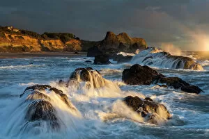 Editor's Picks: Waves crashing on rocks and washing down the sides at sunset