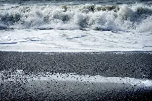 Pebble Prints: Waves Reynisfjara Black Sand Beach, South Shore, Iceland. Sand is black obsidian