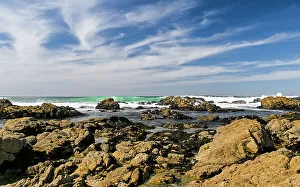 Rolling Prints: Waves rolling in and crashing on the granite rocks of the Pacific Coast of Monterey Bay on a beautiful day