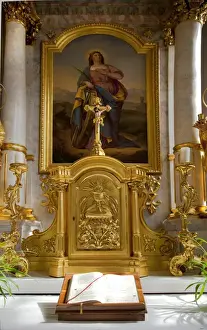 Low Angle Prints: Wels, Upper Austria, Austria - An open bible is set in front of a gold iconic carving
