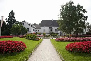 Fragrant Prints: Wels, Upper Austria, Austria - A pathway is leading through a garden with grass