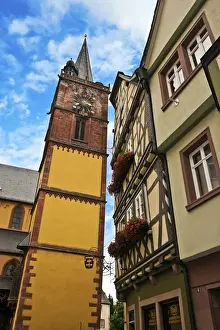 Miva Stock Prints: Wertheim, Franconia, Germany, A clock tower sits next to medieval Cross Timbered Houses