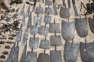 West Africa Prints: West Africa, Benin. Various metal tools for sale at open-air market