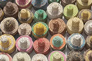 West Africa, The Gambia, Banjul. A collection of colorful woven baskets viewed from above