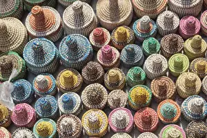 Plastic Prints: West Africa, The Gambia, Banjul. A collection of colorful woven baskets viewed from above
