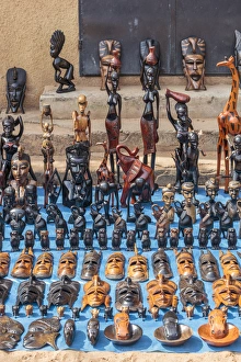 West Africa, The Gambia, Banjul. Wooden masks, animals, and other crafts for sale