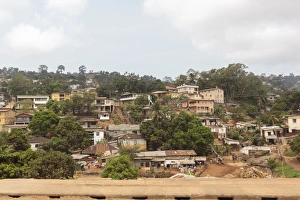 West Africa Prints: West Africa, Sierra Leone, Freetown. Suburban development houses on a hillside