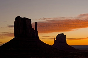 The west and east Mitten buttes silhouetted at sunset, Monument Valley, Navajo Tribal Park, Arizona