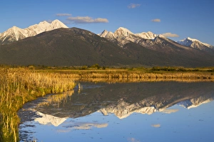 Images Dated 6th May 2012: Wetlands pond reflects Mission Mountain Range at Ninepipe WMA near Ronan, Montana, USA