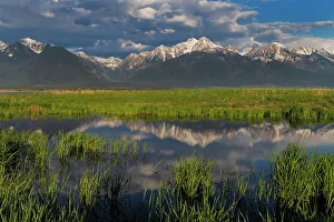 Ninepipe National Wildlife Refu Prints: Wetlands pond reflects the Mission Mountains at sunset at Ninepipe National Wildlife Refuge near Ronan