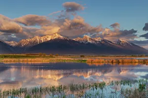 Ninepipe National Wildlife Refu Prints: Wetlands pond reflects the Mission Mountains at sunset at Ninepipe National Wildlife Refuge near Ronan