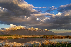 Ninepipe National Wildlife Refu Prints: Wetlands pond reflects the Mission Mountains at sunset at the Ninepipe National Wildlife Refuge near Ronan