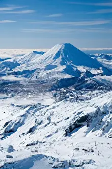 Whakapapa Skifield on Mt Ruapehu, and Mt Ngauruhoe (distance) Tongariro National Park