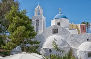 Curved Prints: White curved colorful buildings in small traditional village near Kamari in Santorini