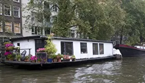 Houseboat Prints: A white houseboat with lots of pink flowers surrounded by trees