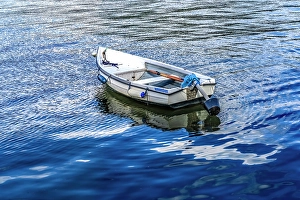 White rowboat in harbor, Dartmouth, Devon, England