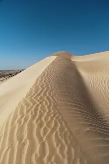 Vast Prints: The white sand dunes of the Khaluf desert. Khaluf Desert, Arabian Peninsula, Oman