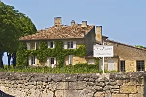 Roadsign Prints: A white sign saying Clos Fourtet 1er premier first Grand Cru Classe and the chateau building itself