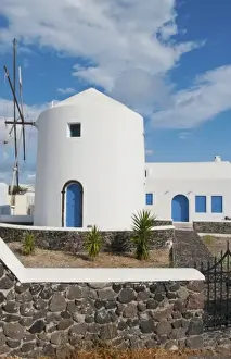 Images Dated 2028: White windmill house in town in valley of Fira in Santorina Greece in Greek Islands