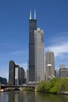 Willis Tower (previously the Sears Tower) looms over the Chicago skyline and Chicago River