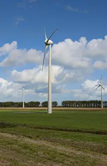 Wind energy wind mills large in farmland outside of Amsterdam Holland Netherlands