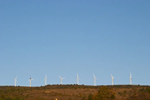Images Dated 11th December 2006: Wind power turbines on a mountain hill top crest against a blue sky. Limoux. Languedoc