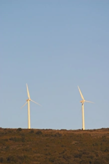 Images Dated 11th December 2006: Wind power turbines on a mountain hill top crest against a blue sky. Limoux. Languedoc