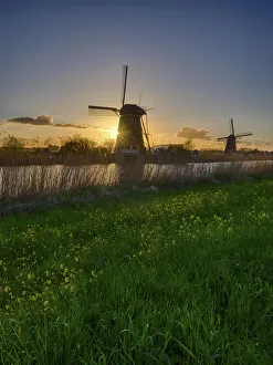 Netherlands Prints: Windmill along the canal at sunset