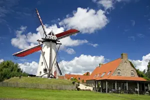Dine Prints: A windmill and old stone restaurant in the town of Ramskapelle in the municipality