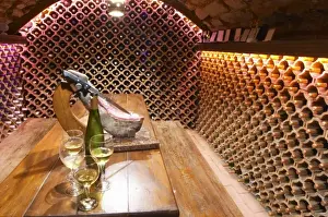 Images Dated 13th July 2006: The wine cellar and tasting room, walls are lined with bottles stacked in terracotta