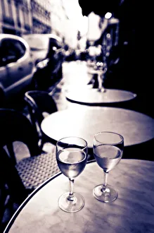 Glass Prints: Wine glasses at an outdoor cafe, Paris, France