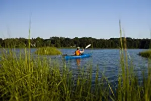 Old Lyme Prints: A woman kayaks in the Black Hall River near the mouth of the Connecticut River in Old Lyme
